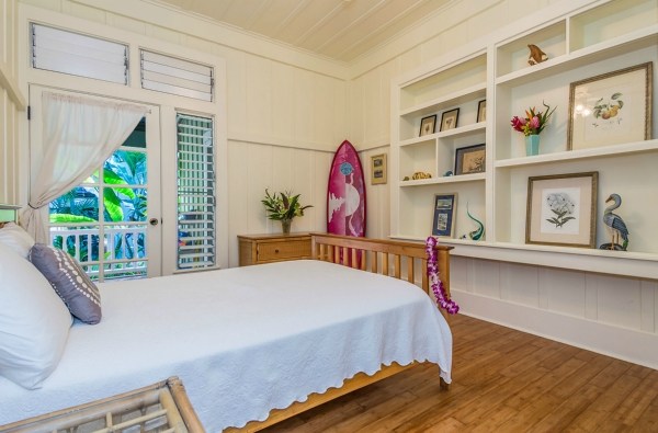 5175 Weke Road Hanalei, HI 96714 - Photo 8 of 25 a bedroom with furniture and a wooden floor