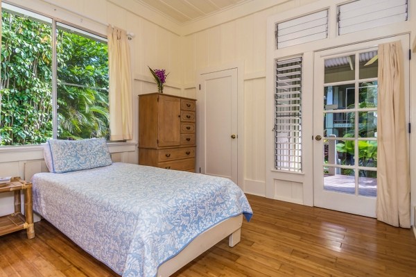 5175 Weke Road Hanalei, HI 96714 - Photo 9 of 25 a bedroom with a bed dresser and a window