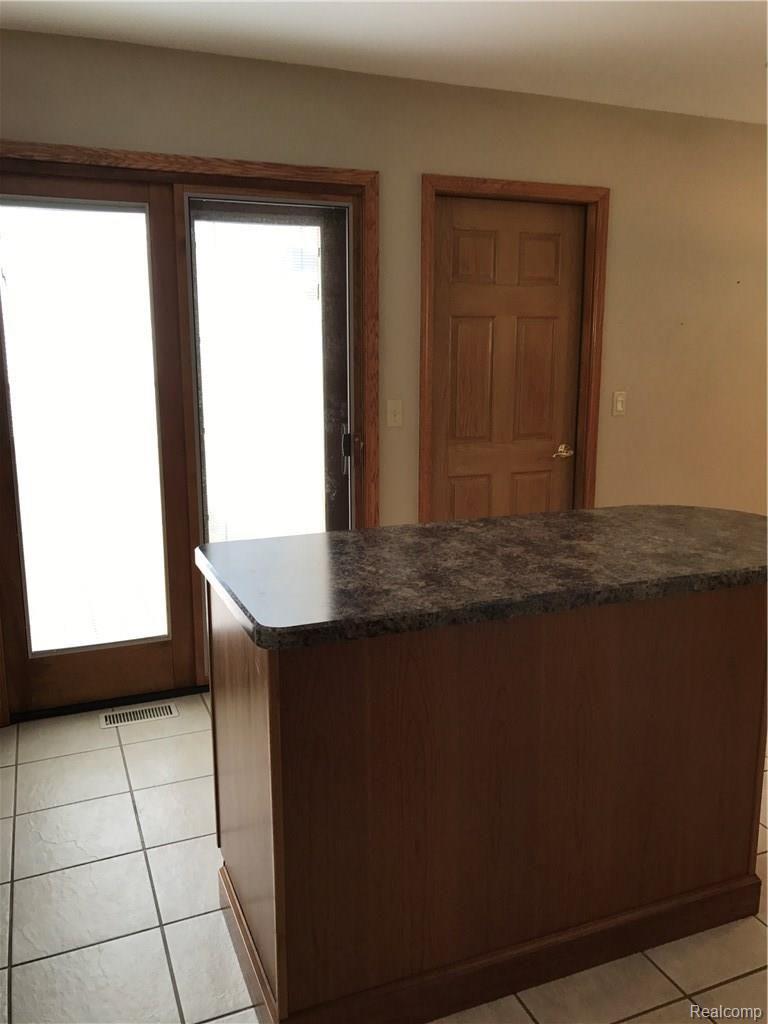 45122 Lemont Road Canton, MI 48187 - Photo 14 of 41 Pella door wall leading to outside deck