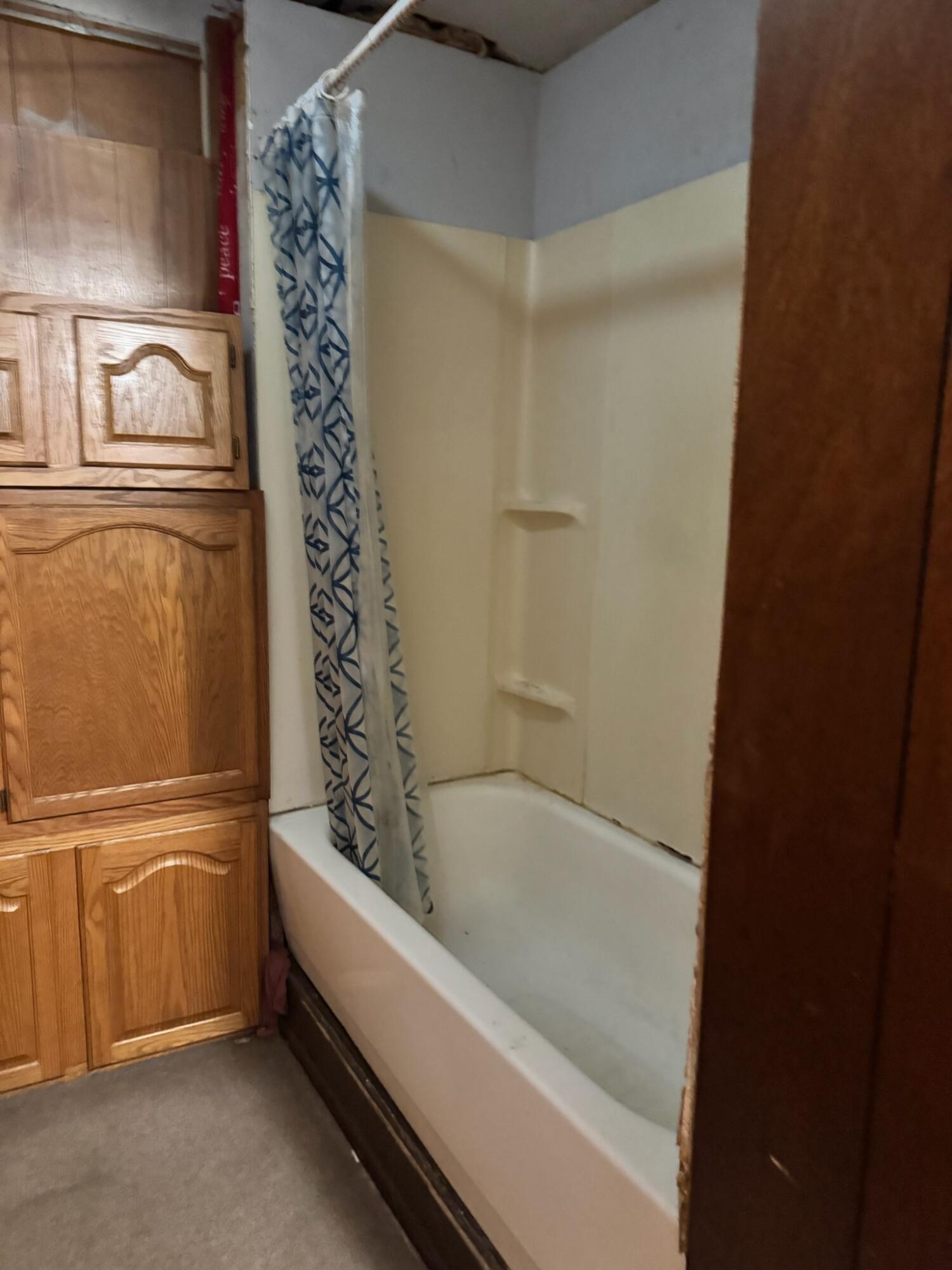 1900 West Old Ridge Road Hobart, IN 46342 - Photo 5 of 11 a bathroom with a bathtub and a shower