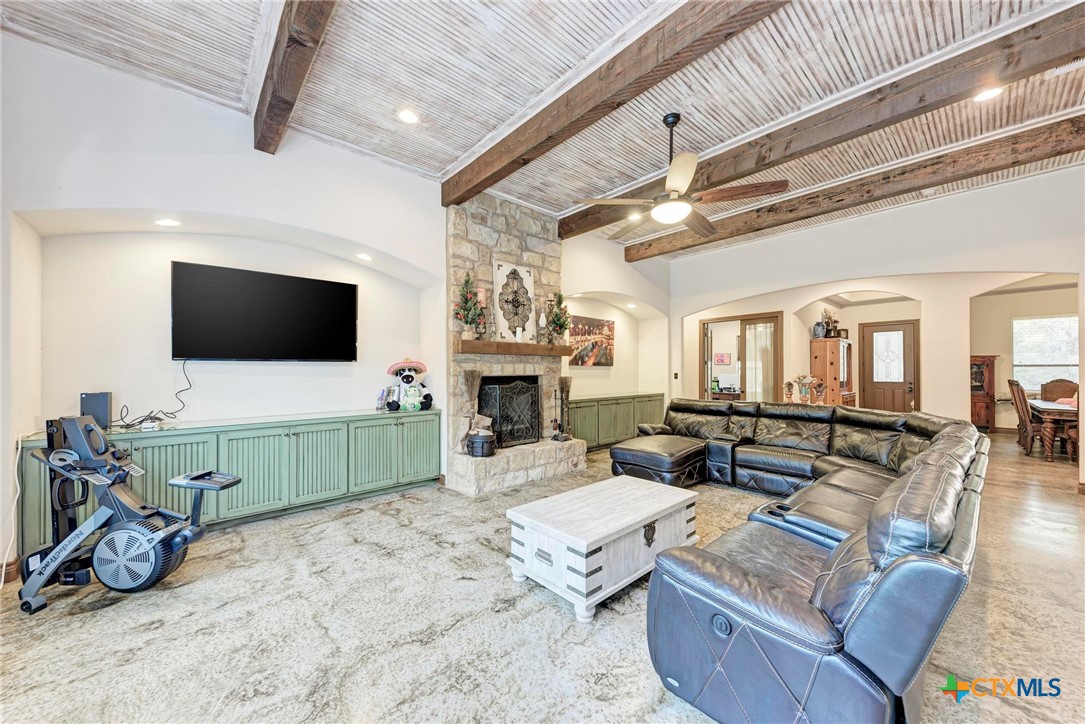 1325 County Road 106 Lampasas, TX 76550 - Photo 1 of 48 a living room with furniture gym equipment and a flat screen tv