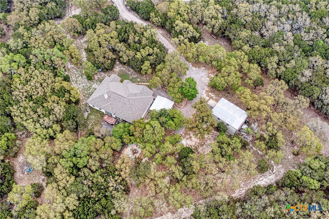 1325 County Road 106 Lampasas, TX 76550 - Photo 17 of 48 an aerial view of a house with a yard and lake view