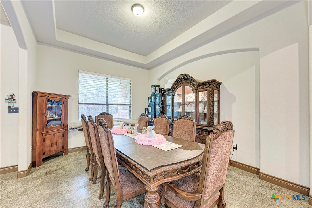 1325 County Road 106 Lampasas, TX 76550 - Photo 19 of 48 a view of a dining room with furniture window and wooden floor