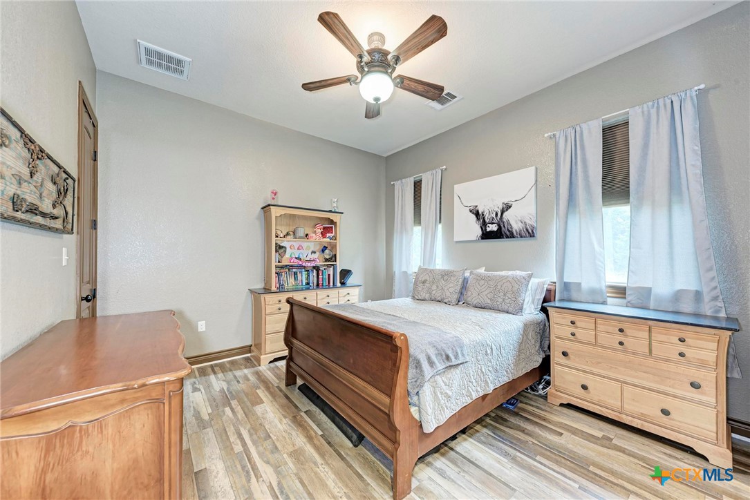1325 County Road 106 Lampasas, TX 76550 - Photo 29 of 48 a bedroom with a bed and a dresser
