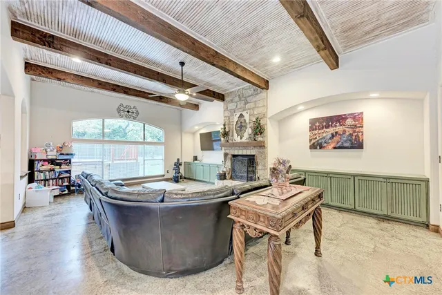 a living room with furniture and a table