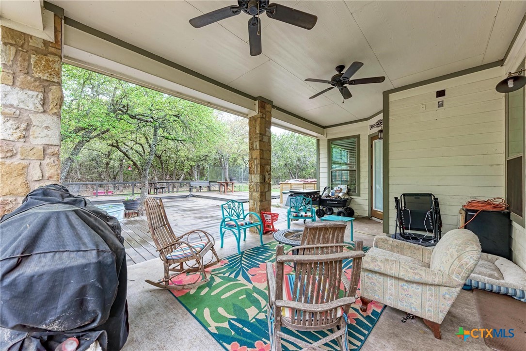 1325 County Road 106 Lampasas, TX 76550 - Photo 38 of 48 a living room with fireplace furniture and a large window