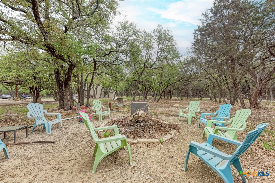 1325 County Road 106 Lampasas, TX 76550 - Photo 43 of 48 a view of backyard with outdoor seating and trees