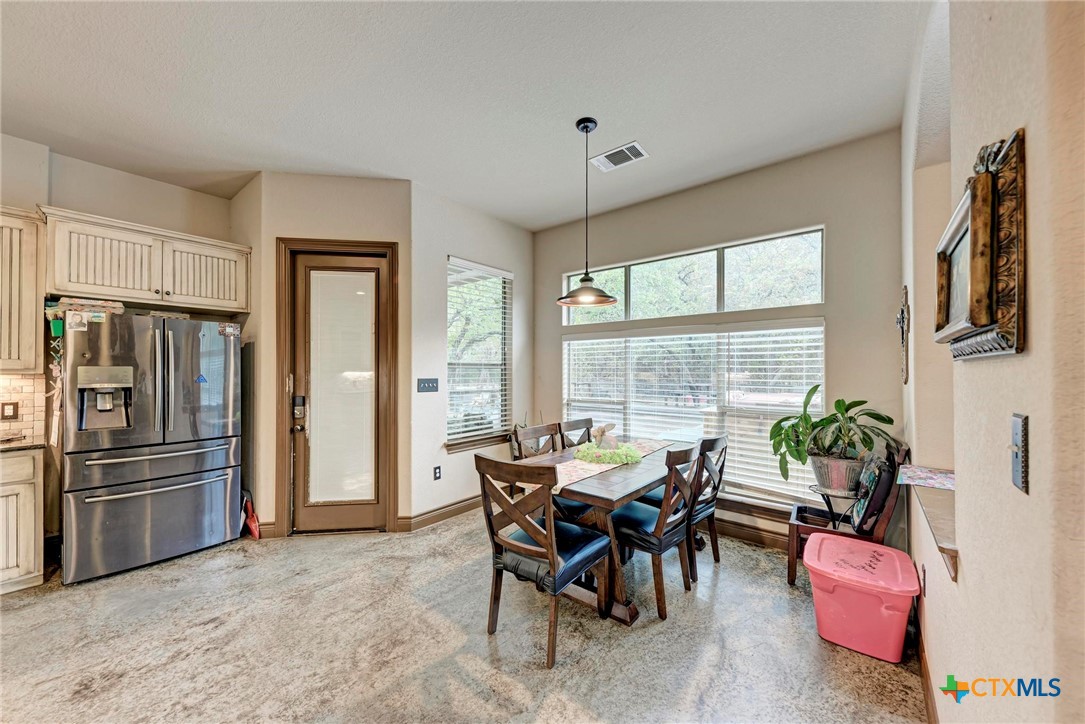 1325 County Road 106 Lampasas, TX 76550 - Photo 9 of 48 a view of a dining room with furniture window and outside view