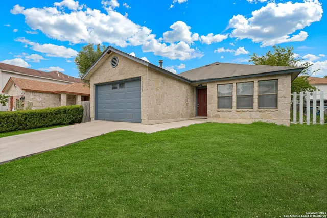 a house view with a garden space