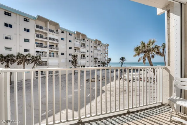 a view of a balcony with wooden floor