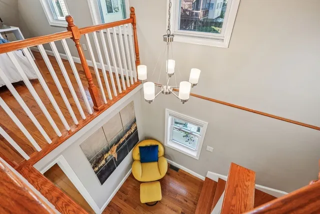 a view of staircase with rug