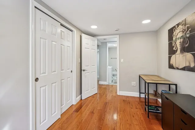 a spacious bedroom with a bed and a table