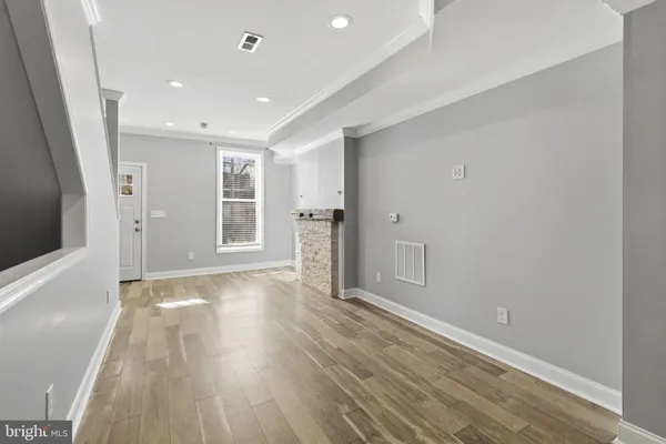 a large kitchen with stainless steel appliances granite countertop a stove sink and cabinets