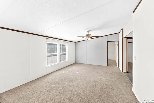 a view of empty room with windows