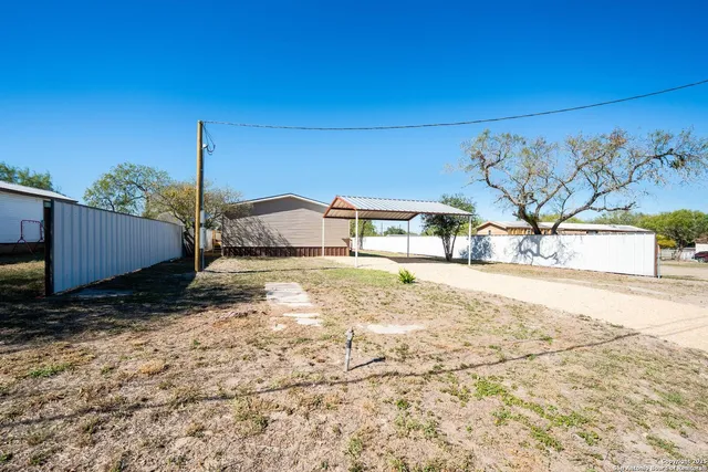 a view of a backyard of a house