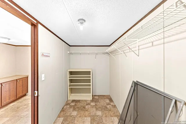 a view of a house with wooden fence
