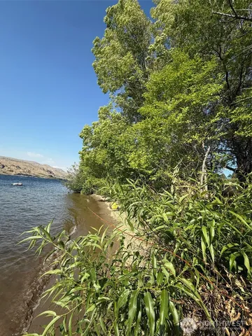 a view of a lake with a yard