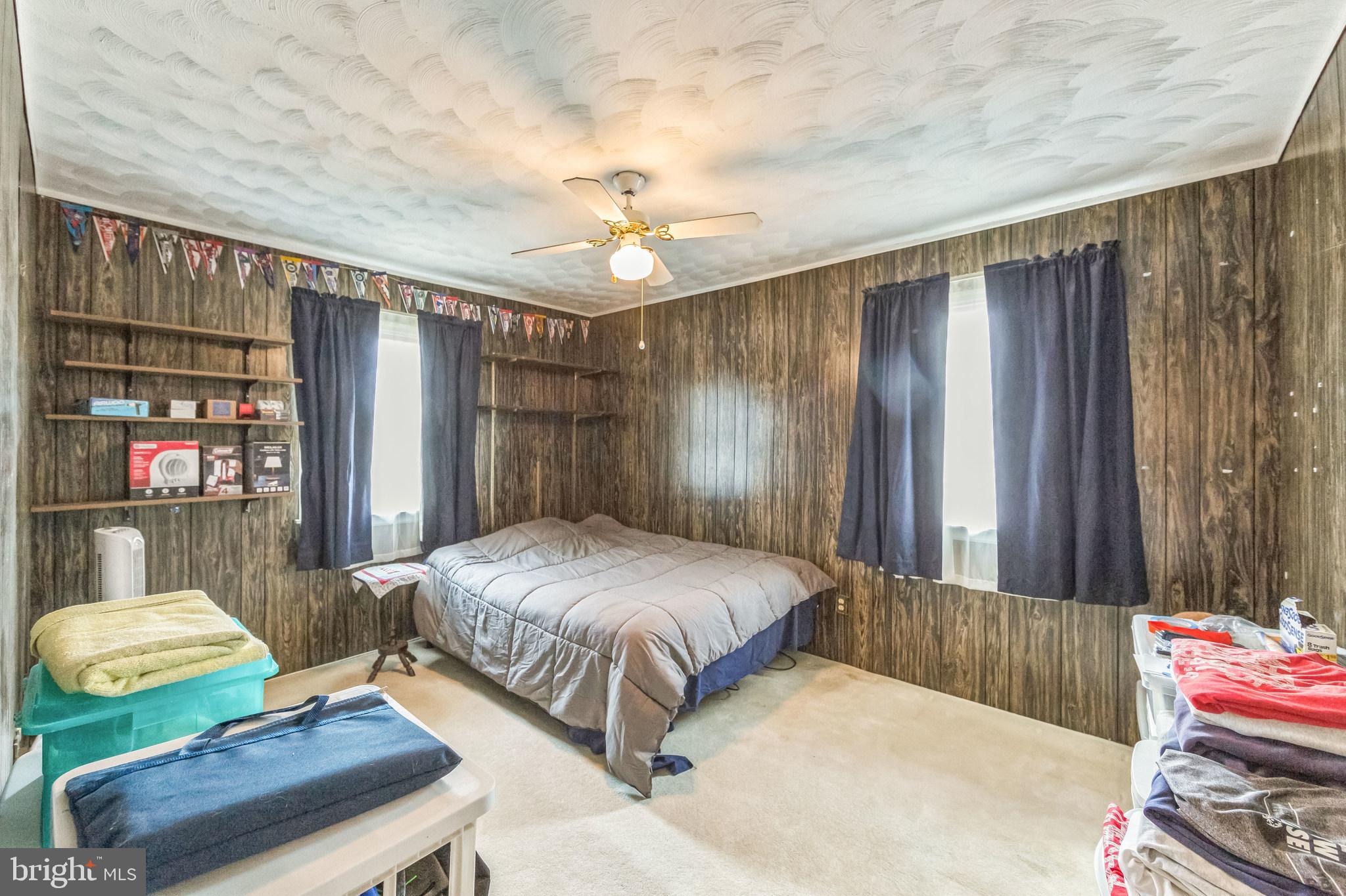 864 Estates Boulevard Hamilton, NJ 08690 - Photo 11 of 15 a spacious bedroom with a bed and a table