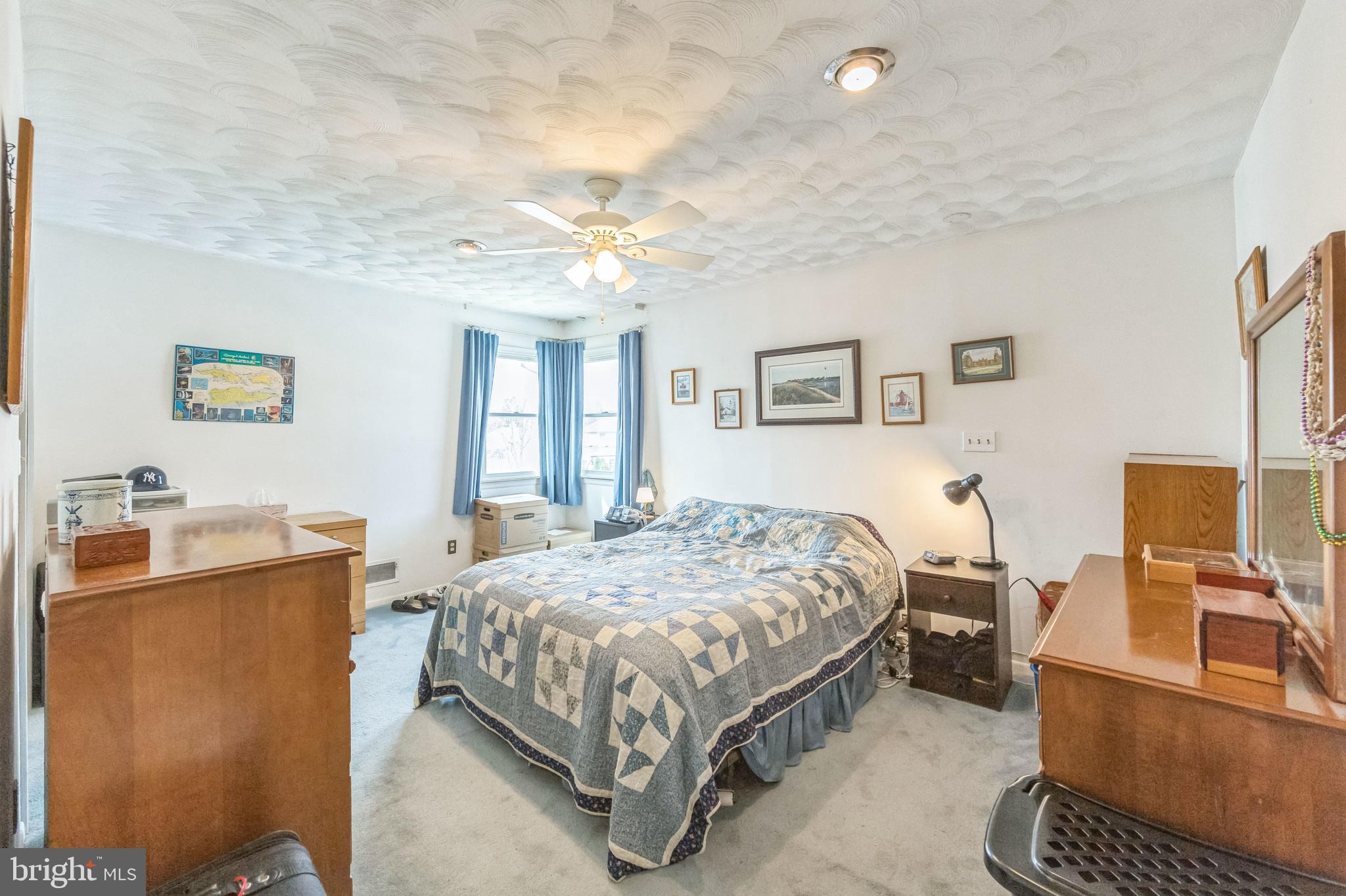 864 Estates Boulevard Hamilton, NJ 08690 - Photo 12 of 15 a bedroom with a bed and wooden floor