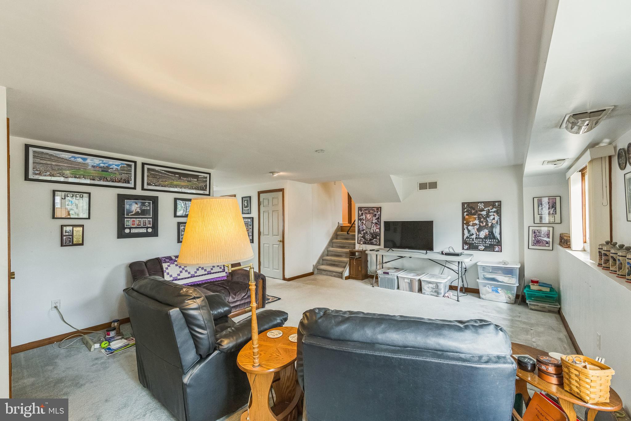 864 Estates Boulevard Hamilton, NJ 08690 - Photo 8 of 15 a living room with furniture and a flat screen tv