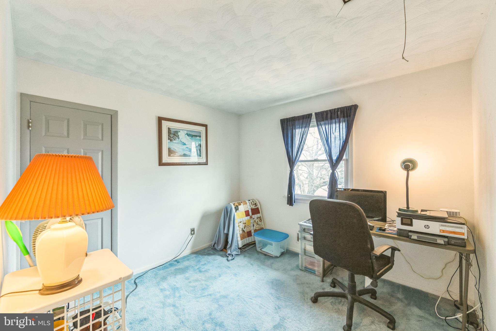 864 Estates Boulevard Hamilton, NJ 08690 - Photo 9 of 15 a view of a workspace with furniture and a window