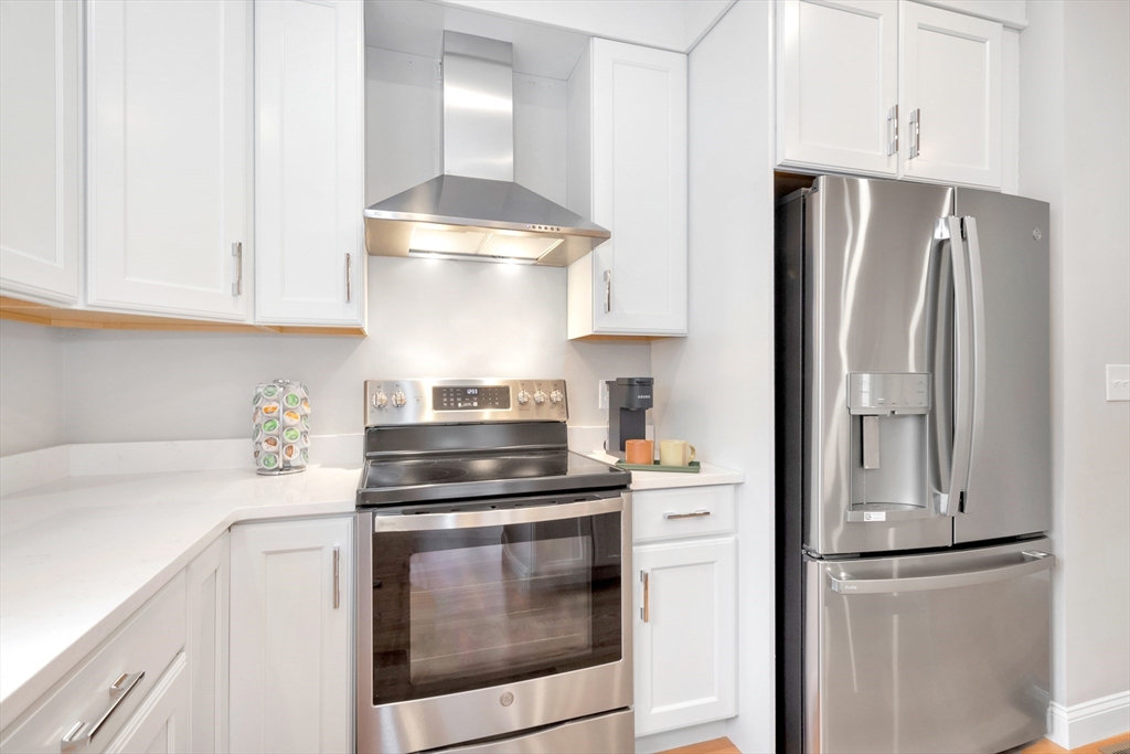 29 Willow Pond Circle, Unit 29 Medway, MA 02053 - Photo 13 of 38 a kitchen with cabinets and stainless steel appliances