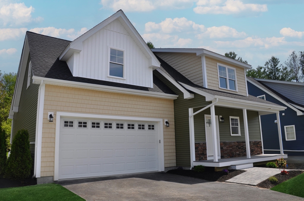 29 Willow Pond Circle, Unit 29 Medway, MA 02053 - Photo 2 of 38 a front view of a house with yard