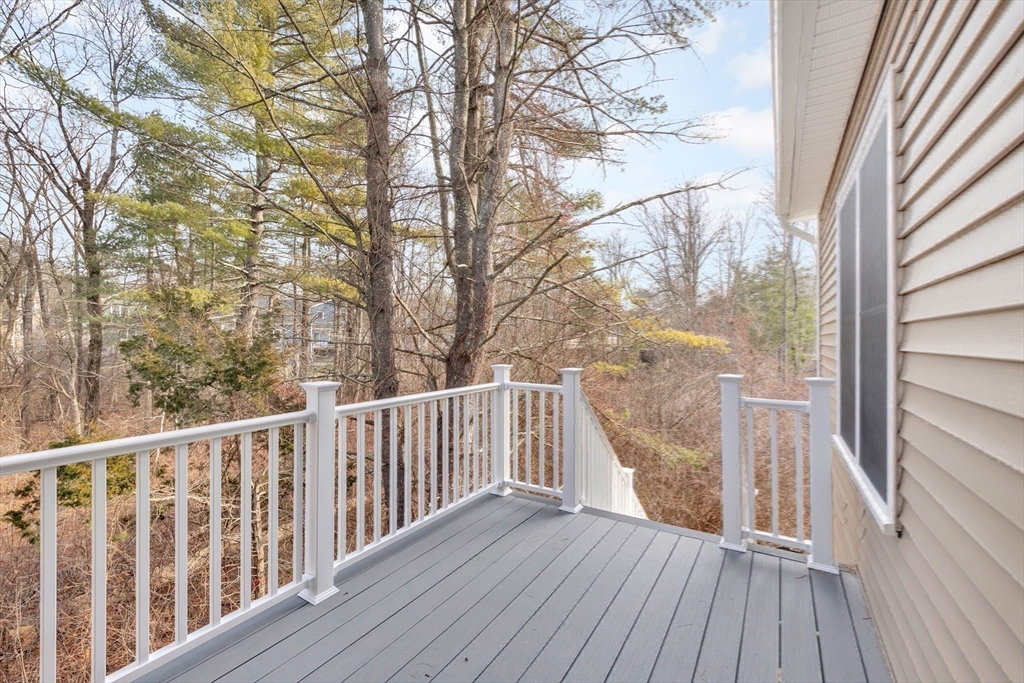 29 Willow Pond Circle, Unit 29 Medway, MA 02053 - Photo 31 of 38 a view of balcony with wooden floor and fence