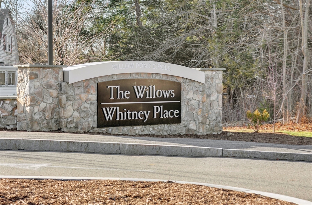 29 Willow Pond Circle, Unit 29 Medway, MA 02053 - Photo 33 of 38 a sign on the side of a building