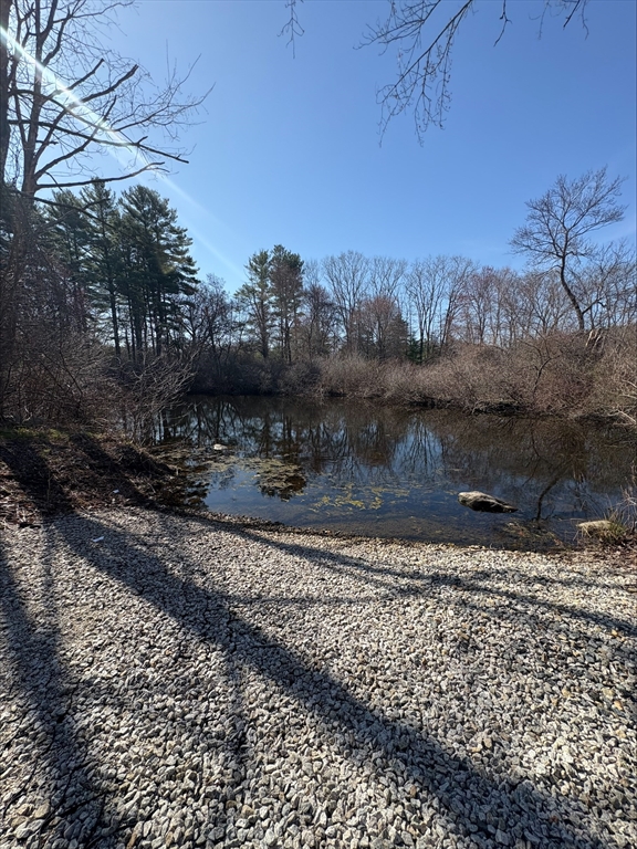 29 Willow Pond Circle, Unit 29 Medway, MA 02053 - Photo 37 of 38 a view of a yard with wooden fence