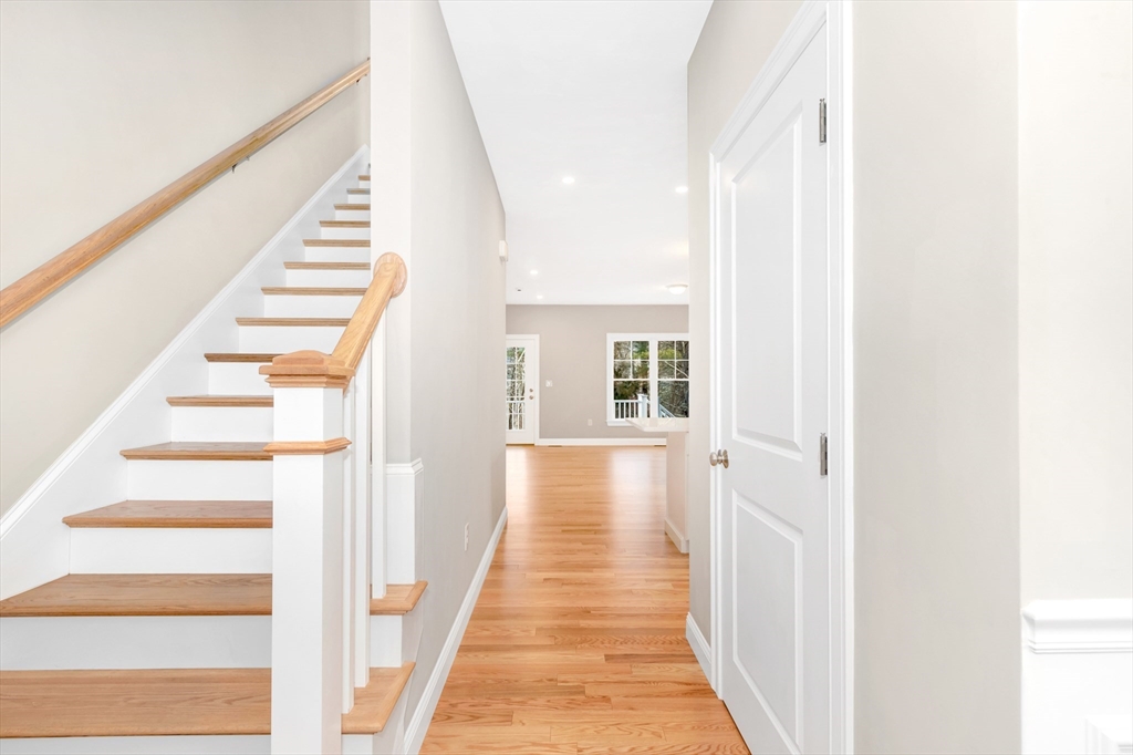 29 Willow Pond Circle, Unit 29 Medway, MA 02053 - Photo 4 of 38 a view of a hallway with wooden floor and entryway