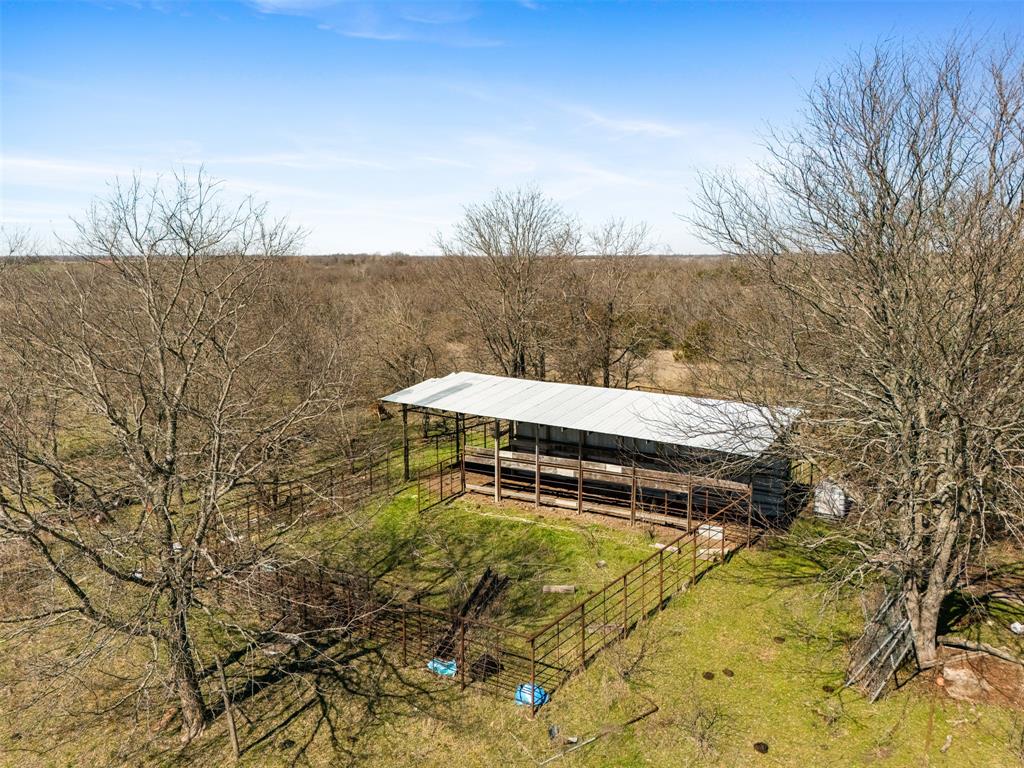 26100 Co Road Petty, TX 75470 - Photo 22 of 26 a view of a yard with an outdoor space