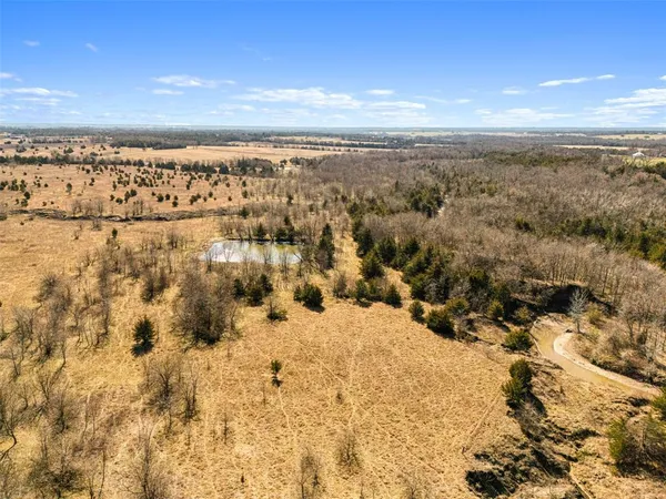 a view of a lake with a yard