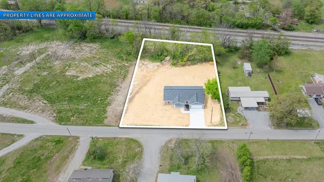 a view of a yard with potted plants
