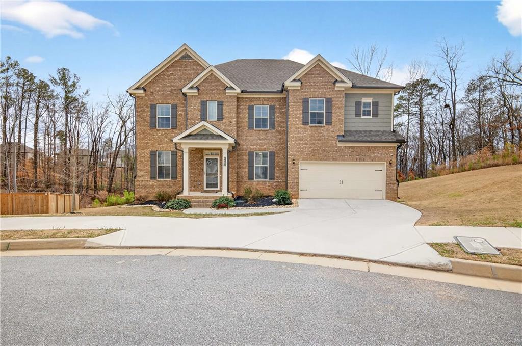 front view of a house with a yard