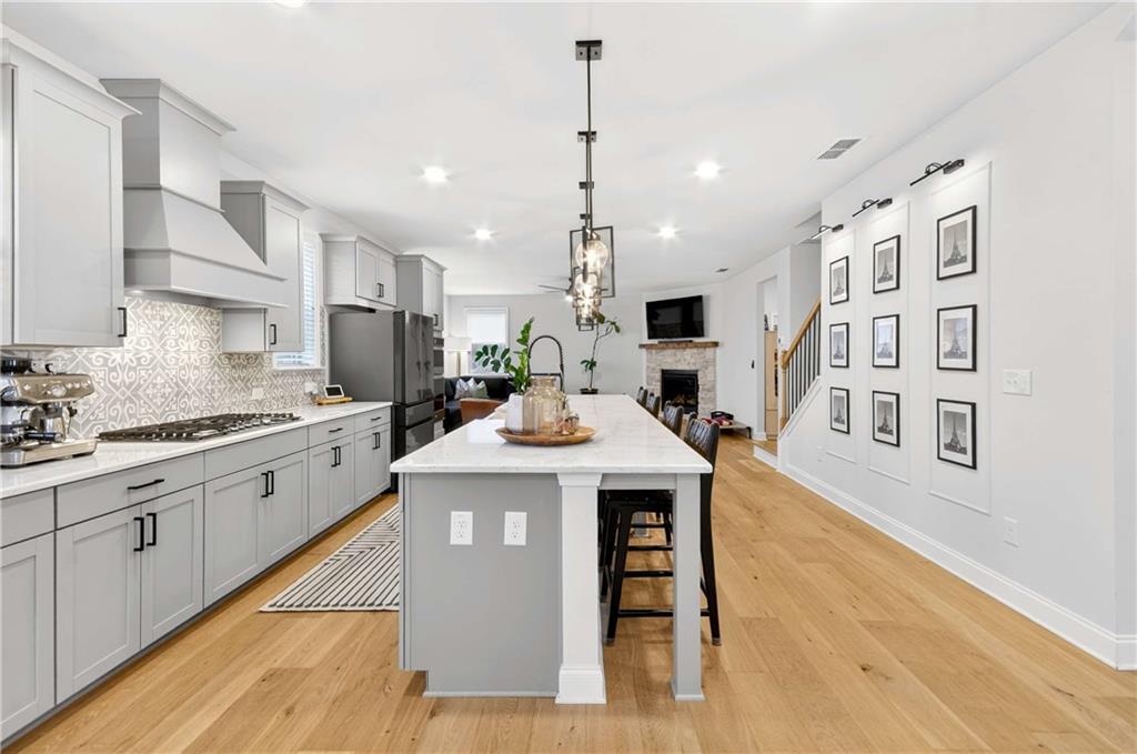 3481 Jasmine Way Atlanta, GA 30331 - Photo 14 of 41 a kitchen with stainless steel appliances granite countertop a sink a stove and a wooden floors