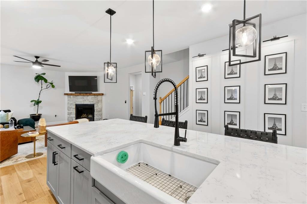 3481 Jasmine Way Atlanta, GA 30331 - Photo 15 of 41 a kitchen with a refrigerator a stove and a sink with wooden floor