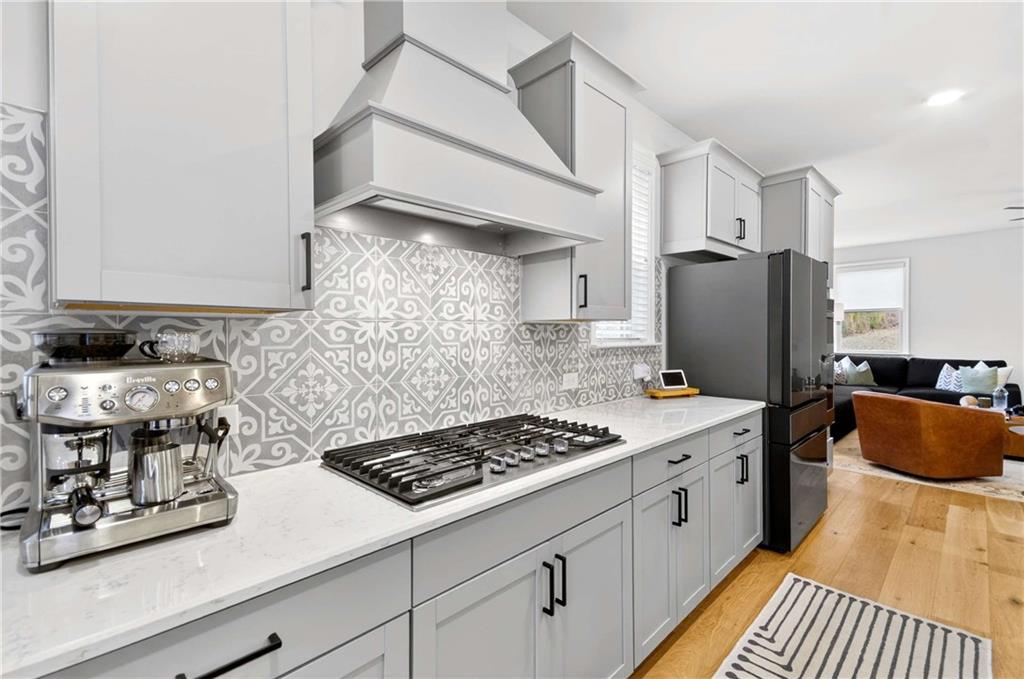 3481 Jasmine Way Atlanta, GA 30331 - Photo 16 of 41 a kitchen with stainless steel appliances granite countertop a sink stove and refrigerator
