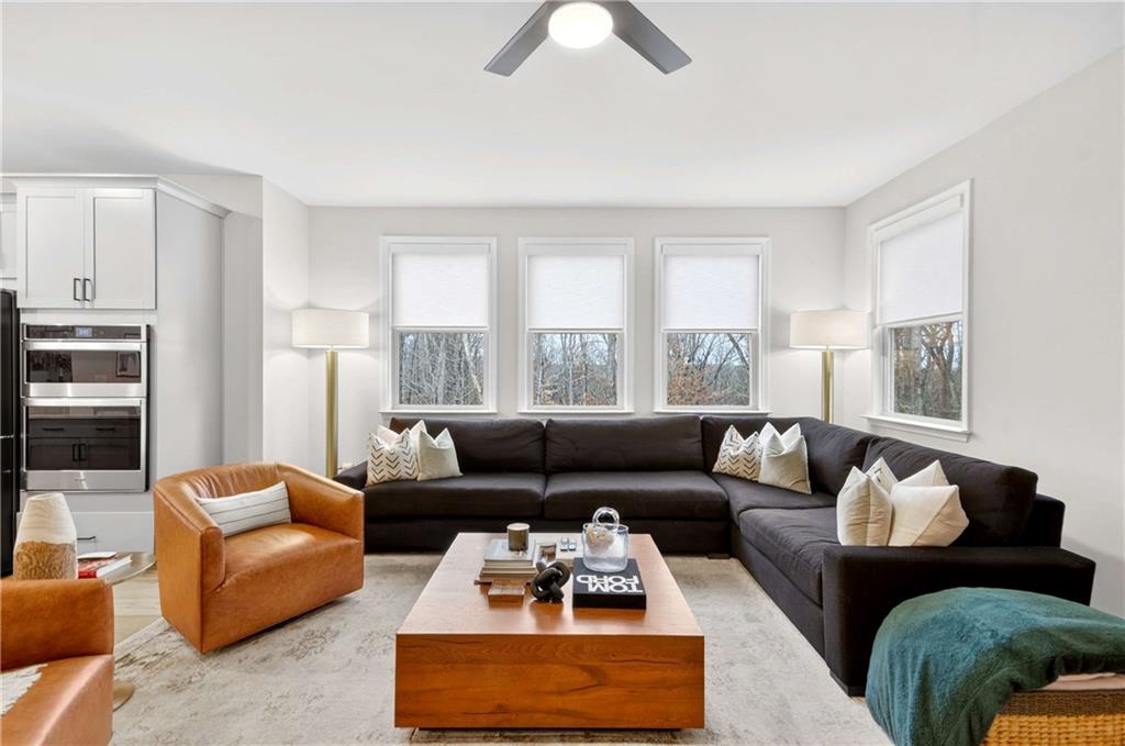 3481 Jasmine Way Atlanta, GA 30331 - Photo 18 of 41 a living room with furniture ceiling fan and a large window