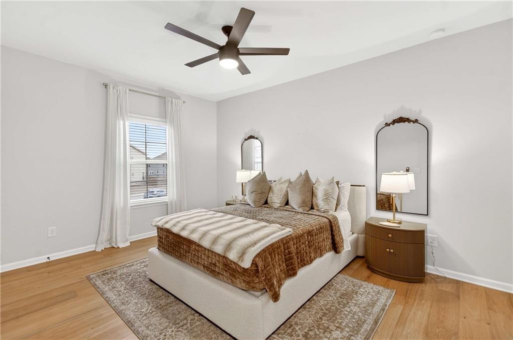 3481 Jasmine Way Atlanta, GA 30331 - Photo 21 of 41 a bedroom with a bed and a potted plant