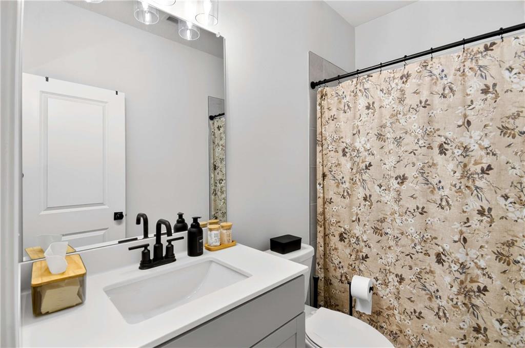 3481 Jasmine Way Atlanta, GA 30331 - Photo 23 of 41 a bathroom with a sink and a mirror