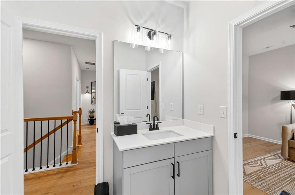 3481 Jasmine Way Atlanta, GA 30331 - Photo 27 of 41 a bathroom with a sink and a mirror