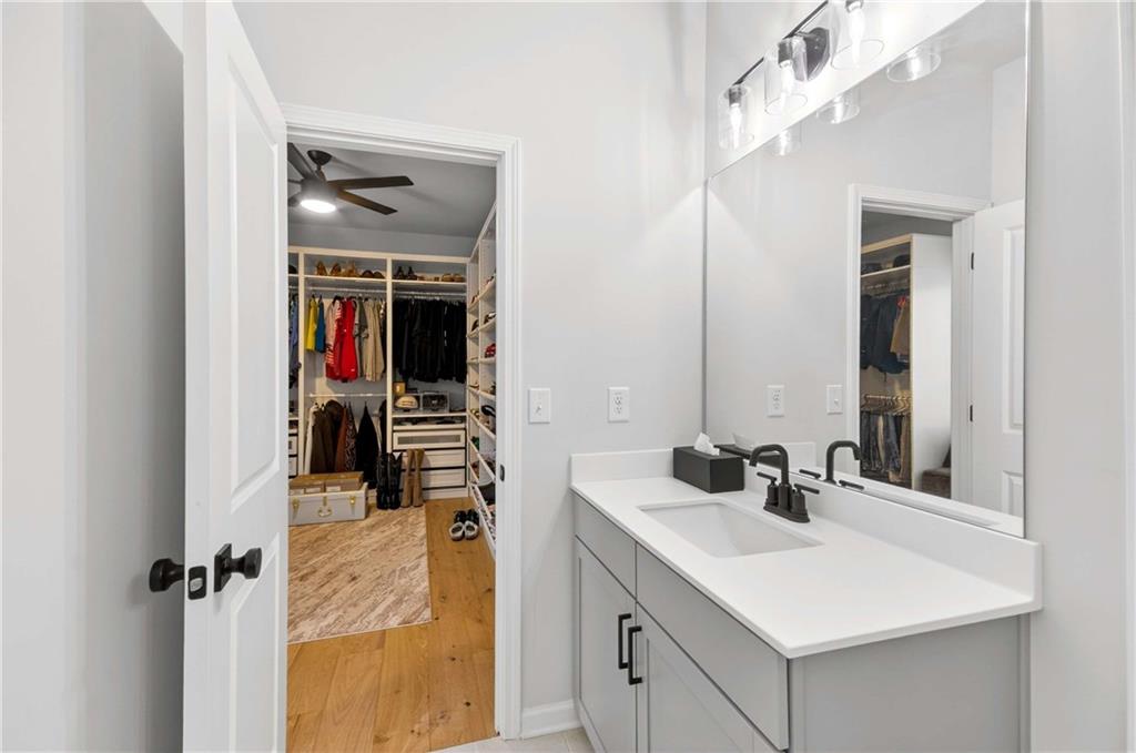 3481 Jasmine Way Atlanta, GA 30331 - Photo 28 of 41 a en suite bathroom with a sink and a mirror