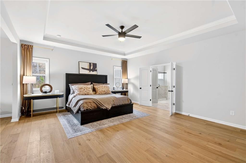 3481 Jasmine Way Atlanta, GA 30331 - Photo 30 of 41 a bedroom with a bed and wooden floor