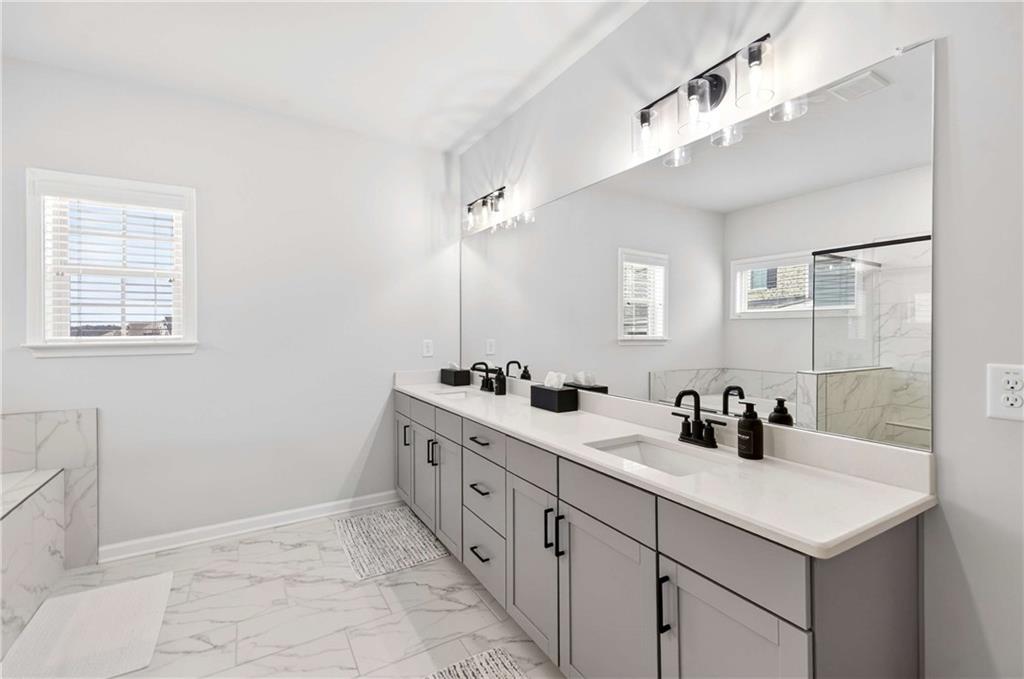3481 Jasmine Way Atlanta, GA 30331 - Photo 32 of 41 a bathroom with a sink and a mirror
