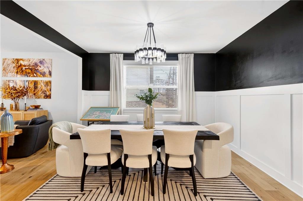 3481 Jasmine Way Atlanta, GA 30331 - Photo 8 of 41 a view of a dining room with furniture wooden floor and a chandelier