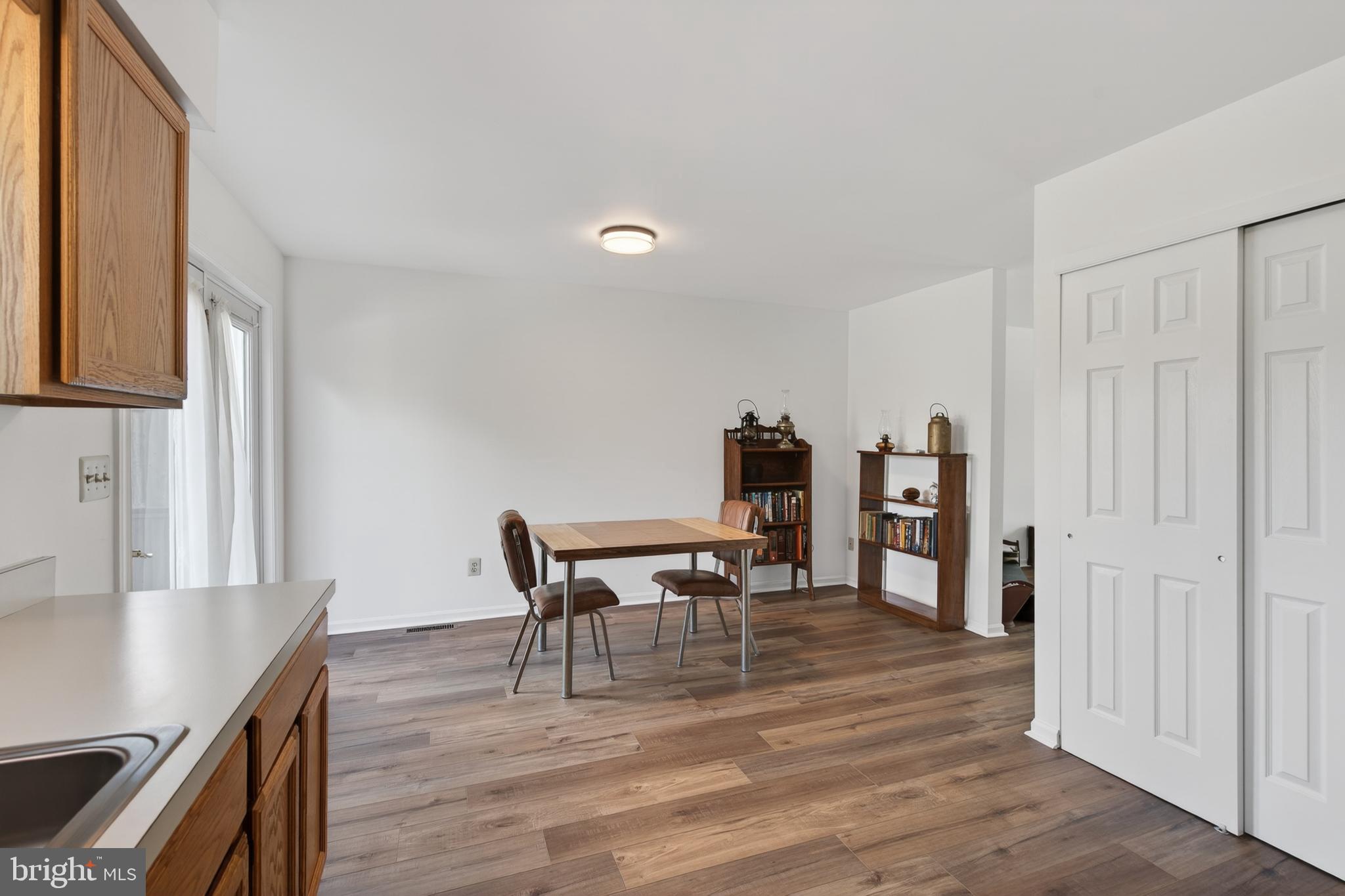 122 Longford Road West Chester, PA 19380 - Photo 12 of 39 a dining room with furniture and wooden floor