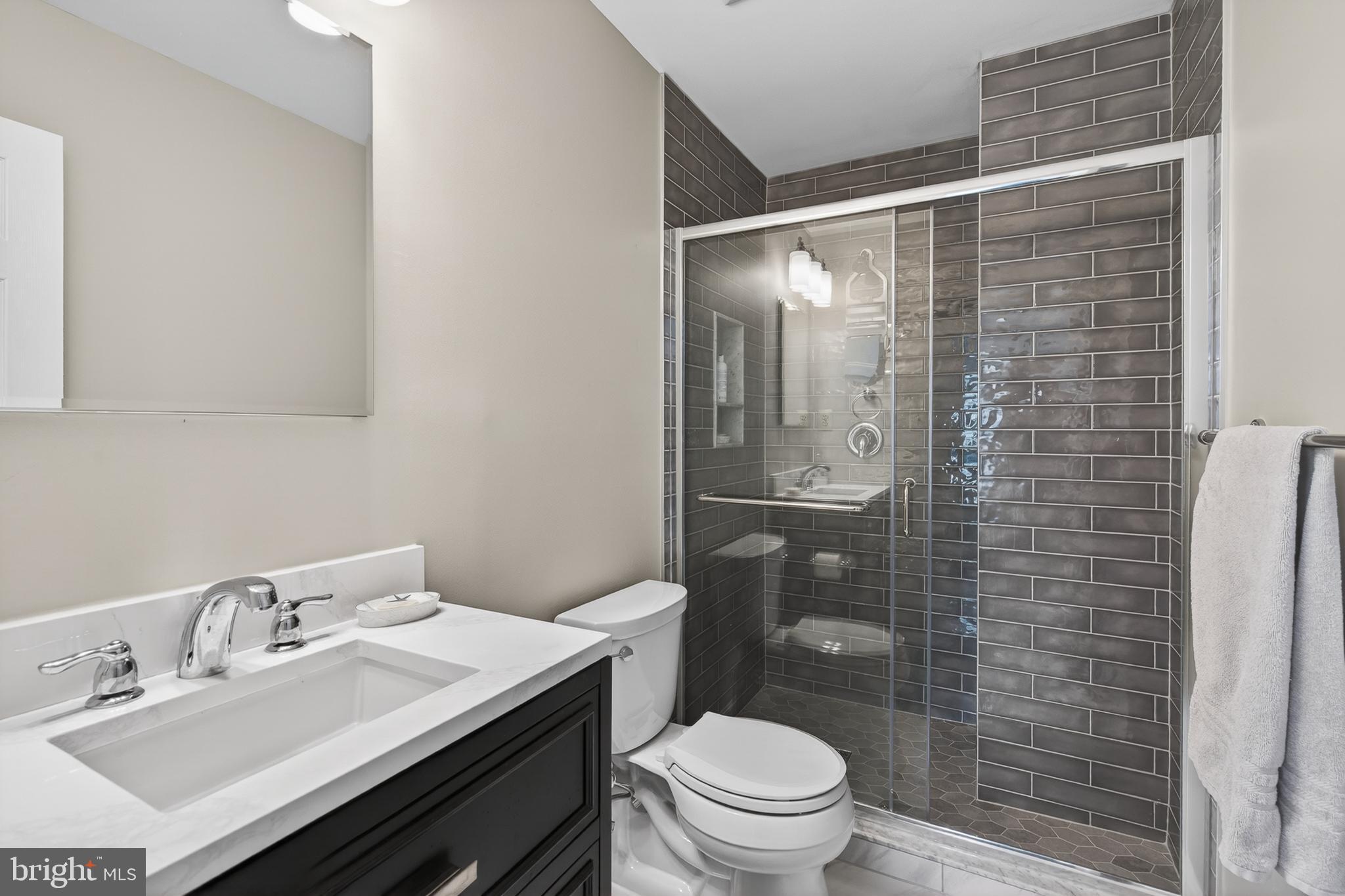 122 Longford Road West Chester, PA 19380 - Photo 20 of 39 a bathroom with a sink toilet and shower