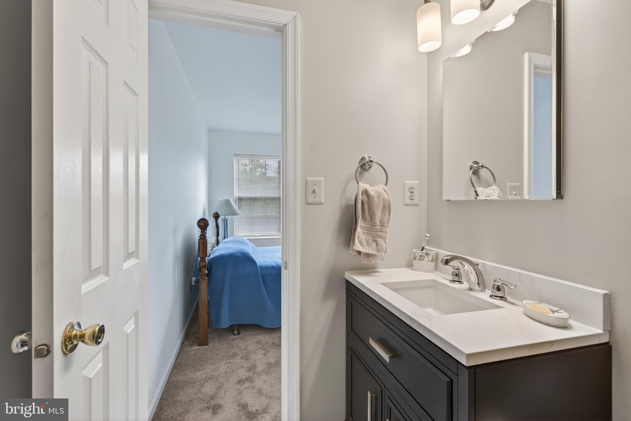 122 Longford Road West Chester, PA 19380 - Photo 22 of 39 a en suite bathroom with a double vanity sink and mirror