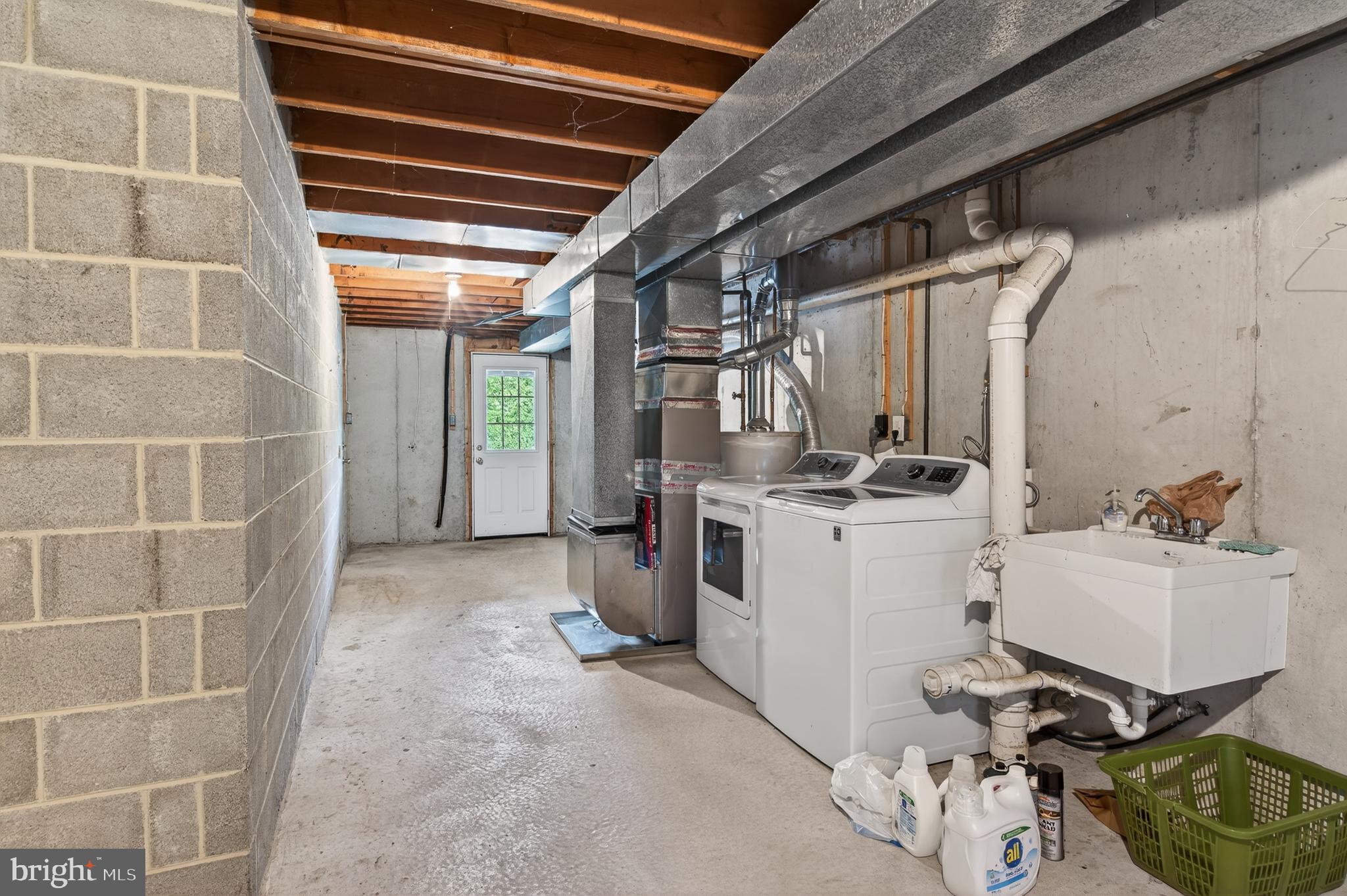 122 Longford Road West Chester, PA 19380 - Photo 32 of 39 a view of a storage & utility room with washer and dryer